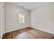 Bedroom with window and wood-look floors at 1123 Claret Ln, Morrisville, NC 27560