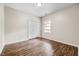 Bedroom with wood-look flooring, closet and window at 1123 Claret Ln, Morrisville, NC 27560