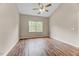 Bright bedroom with wood-look floors and a window providing ample natural light at 1123 Claret Ln, Morrisville, NC 27560