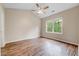 Bedroom featuring vaulted ceiling, wood-look flooring, and a large window to the outside at 1123 Claret Ln, Morrisville, NC 27560
