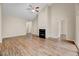 Inviting living room featuring a cozy fireplace, vaulted ceilings, and hardwood floors at 1123 Claret Ln, Morrisville, NC 27560