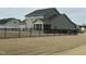Spacious backyard featuring a screened-in porch and a black metal fence at 116 Polenta Fields Dr, Smithfield, NC 27577