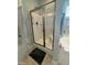 Bathroom showcasing shower with glass doors, built in seating and modern fixtures at 116 Polenta Fields Dr, Smithfield, NC 27577