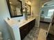 Elegant bathroom boasts a double vanity with marble countertops and access to the bedroom at 116 Polenta Fields Dr, Smithfield, NC 27577