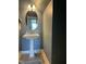 Beautiful powder room with pedestal sink, decorative mirror, and modern wall color at 116 Polenta Fields Dr, Smithfield, NC 27577