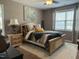 Bedroom featuring a ceiling fan, a queen bed and decorative accents at 116 Polenta Fields Dr, Smithfield, NC 27577