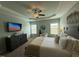 Airy bedroom provides great natural light and ample space with a dresser and decor at 116 Polenta Fields Dr, Smithfield, NC 27577
