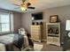 Bedroom featuring a ceiling fan, a mounted television, a queen bed and neutral color scheme at 116 Polenta Fields Dr, Smithfield, NC 27577