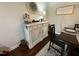 A buffet table with a decorative clock, lamp, and decor provides an elegant touch to this dining space at 116 Polenta Fields Dr, Smithfield, NC 27577