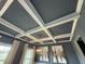 Detailed coffered ceiling design adds architectural interest to the living space at 116 Polenta Fields Dr, Smithfield, NC 27577