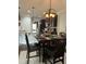 Cozy dining area featuring a pendant light fixture and dark wood table set for four at 116 Polenta Fields Dr, Smithfield, NC 27577