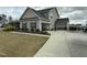 Charming two-story home with an attached garage and a well-manicured lawn at 116 Polenta Fields Dr, Smithfield, NC 27577