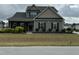 Charming two-story home with a welcoming front porch and dark shutters at 116 Polenta Fields Dr, Smithfield, NC 27577