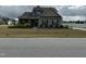 Charming two-story home with a welcoming covered porch and manicured front yard at 116 Polenta Fields Dr, Smithfield, NC 27577