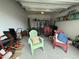 Organized garage space with a trailer, chairs, and storage items at 116 Polenta Fields Dr, Smithfield, NC 27577
