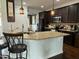 Well-equipped kitchen with granite countertops, stainless steel appliances, and dark wood cabinets at 116 Polenta Fields Dr, Smithfield, NC 27577