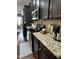 Kitchen featuring granite countertops, stainless steel appliances and dark wood cabinets at 116 Polenta Fields Dr, Smithfield, NC 27577