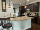 Well-equipped kitchen with granite countertops, stainless steel appliances, and dark wood cabinets at 116 Polenta Fields Dr, Smithfield, NC 27577