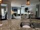 Open concept kitchen with granite countertops, breakfast bar, and view into living room at 116 Polenta Fields Dr, Smithfield, NC 27577