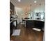 Spacious kitchen featuring granite countertops, stainless steel appliances, and hardwood floors at 116 Polenta Fields Dr, Smithfield, NC 27577