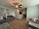 Upstairs Living room featuring stylish sofas, ceiling fan and open floorplan at 116 Polenta Fields Dr, Smithfield, NC 27577