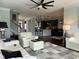 Spacious living room with hardwood floors, ceiling fan, and an open floor plan at 116 Polenta Fields Dr, Smithfield, NC 27577