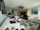 Spacious living room with hardwood floors, ceiling fan, and an open floor plan at 116 Polenta Fields Dr, Smithfield, NC 27577