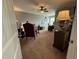 Spacious home office with carpet, a ceiling fan, and several desks for working and studying at 116 Polenta Fields Dr, Smithfield, NC 27577
