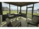 Inviting screened porch with comfortable seating and views of the expansive backyard at 116 Polenta Fields Dr, Smithfield, NC 27577