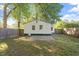 Rear exterior of home with a fenced-in yard and stone pavers at 116 W Mciver St, Zebulon, NC 27597