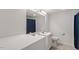 Bright bathroom featuring double sinks with a large mirror and a toilet at 116 W Mciver St, Zebulon, NC 27597