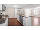 Bright kitchen featuring white cabinetry, stainless steel appliances, and a functional island at 116 W Mciver St, Zebulon, NC 27597