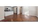 Open-concept layout showcases hardwood flooring connecting the kitchen and living areas at 116 W Mciver St, Zebulon, NC 27597