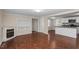 Open-concept living space with fireplace and kitchen, offering ample room to entertain at 116 W Mciver St, Zebulon, NC 27597