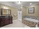 This primary bathroom boasts a gorgeous soaking tub, walk-in shower, a dark vanity, and neutral colors at 1174 Robertson Rd, Roxboro, NC 27574