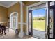 Elegant home foyer with beautiful tile flooring, large windows, and a decorative front door at 1174 Robertson Rd, Roxboro, NC 27574