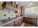 Kitchen with granite countertops, tiled backsplash, and stainless steel appliances at 1174 Robertson Rd, Roxboro, NC 27574