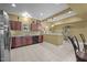 Basement kitchen with stainless steel appliances, granite counters, and bar seating area at 1174 Robertson Rd, Roxboro, NC 27574