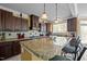 Kitchen with granite countertops, stainless appliances, and breakfast bar seating at 1174 Robertson Rd, Roxboro, NC 27574