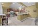 Basement kitchen featuring stainless steel appliances, bar seating, and ample counter space at 1174 Robertson Rd, Roxboro, NC 27574