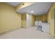 This laundry room features tile floors, washer and dryer hookups, and ample room for laundry at 1174 Robertson Rd, Roxboro, NC 27574