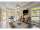 Bright living area with large windows and comfortable seating at 1174 Robertson Rd, Roxboro, NC 27574