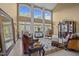 Spacious living room with high ceilings, large windows, and decorative furniture at 1174 Robertson Rd, Roxboro, NC 27574