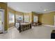 Spacious main bedroom with beautiful tile flooring, neutral colored walls, large windows and a decorative bed frame at 1174 Robertson Rd, Roxboro, NC 27574