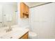 Bathroom with wooden vanity, shower with star curtain, and ample storage space at 127 Long Shadow Pl, Durham, NC 27713