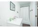 Bathroom featuring a modern sink, mirror, and a shower with a curtain for a clean and functional space at 127 Long Shadow Pl, Durham, NC 27713