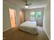 Bright bedroom with an adjacent bathroom featuring a bed, window, and easy access to additional rooms at 127 Long Shadow Pl, Durham, NC 27713