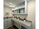 Desk featuring built-in shelves, decor, countertop and a sink at 127 Long Shadow Pl, Durham, NC 27713