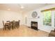 Dining area with fireplace and access to the deck, blending indoor and outdoor living at 127 Long Shadow Pl, Durham, NC 27713