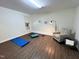 Spacious exercise room with hardwood floors, neutral paint, and ample space for a home gym at 127 Long Shadow Pl, Durham, NC 27713